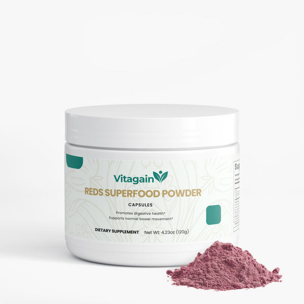 Vitagain Reds Superfood Powder dietary supplement capsules in a white plastic jar, shown with a small pile of dusty magenta-pink powder in front on a clean white background.
