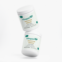 Two white plastic tubs of Vitagain Smoothie Greens dietary supplement floating at an angle on a clean white background.